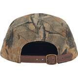 Supreme box logo chino twill cap in real tree camouflage, headwear with adjustable strap and stitched branding.
