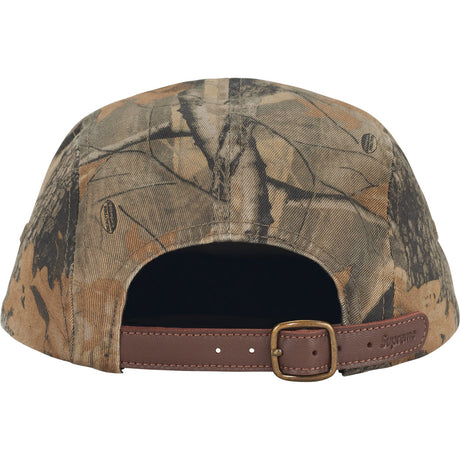 Supreme box logo chino twill cap in real tree camouflage, headwear with adjustable strap and stitched branding.