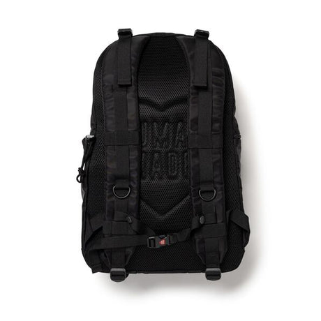 Black Human Made military backpack with multiple compartments and adjustable straps, designed for durable and functional carry.