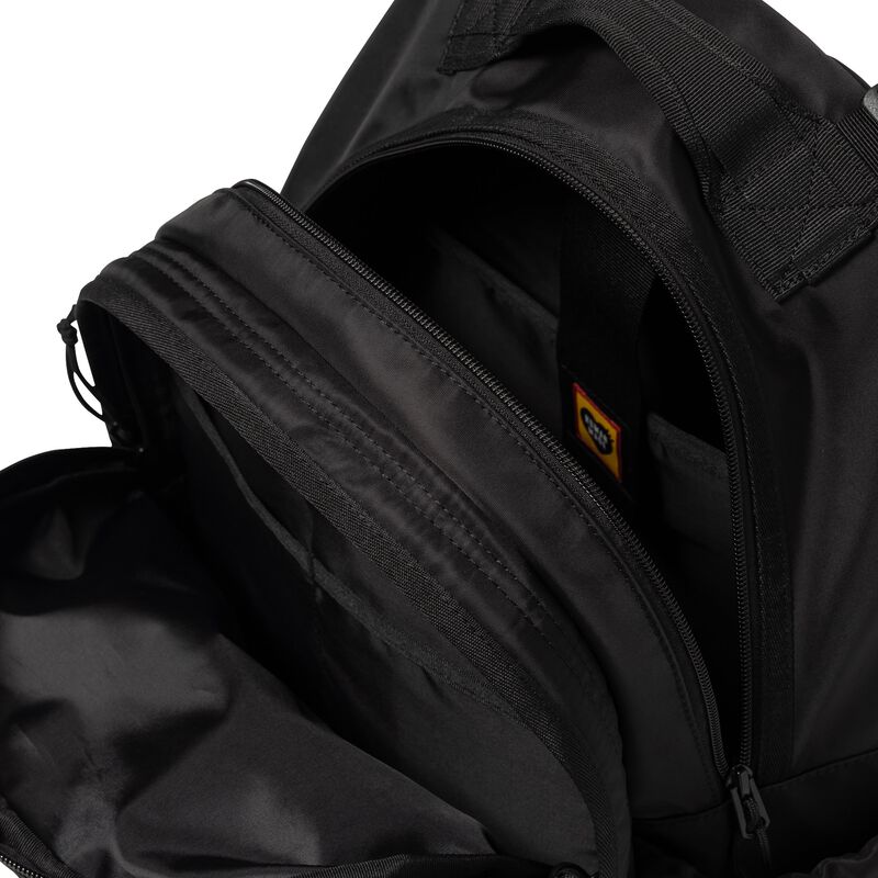 Black Human Made Military Backpack with multiple compartments and adjustable straps, designed for durability and style.