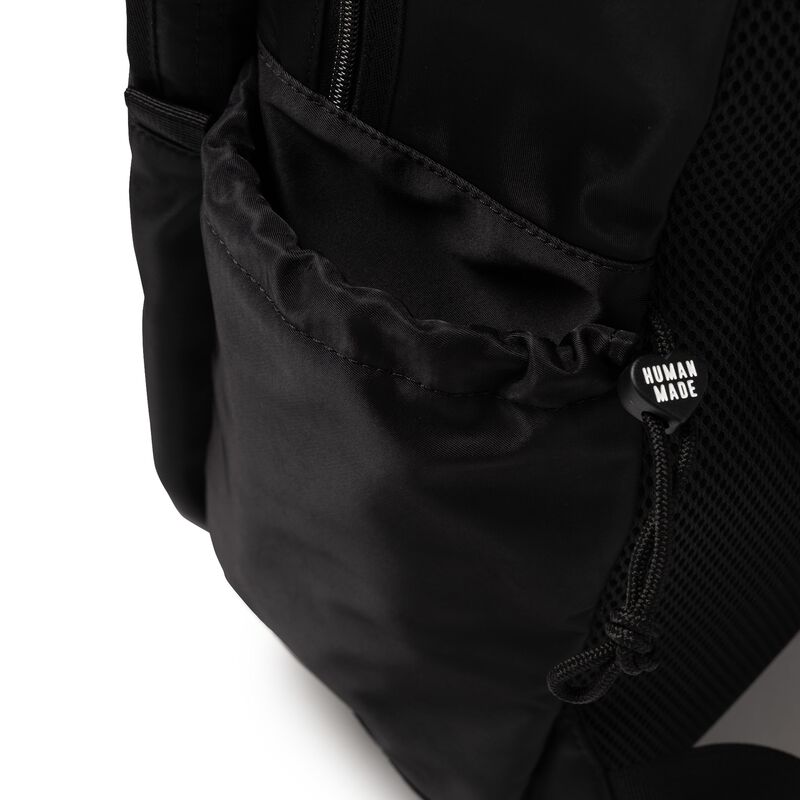 Black Human Made Military Backpack with multiple compartments and adjustable straps, designed for durable everyday use.
