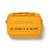 Yellow Human Made military sling bag with adjustable strap, compact design, and multiple compartments for versatile carrying.