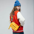 Yellow Human Made military sling bag with adjustable strap and multiple compartments, stylish and functional accessory.