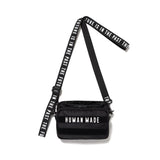 Black Human Made Military Mini Sling Bag with adjustable strap and sleek design, perfect for casual wear and outdoor activities.
