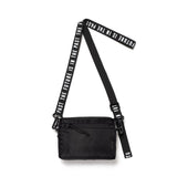 Black Human Made Military Mini Sling Bag with adjustable strap and compact design, ideal for carrying essentials.
