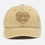Beige Human Made Heart Logo 6-panel cap, casual headwear with embroidered logo, adjustable strap, and classic six-panel design.