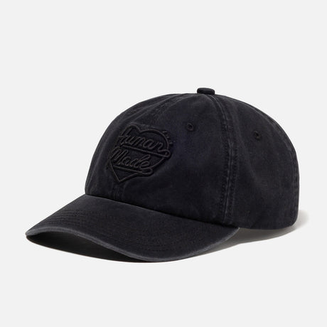 Black Human Made Heart Logo 6-panel cap, stylish headwear with embroidered heart logo on front, adjustable strap at back.