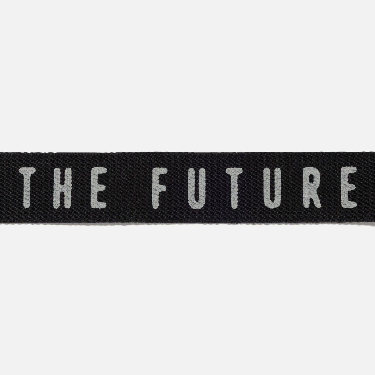 Black Human Made logo belt with adjustable strap and branded metal buckle, stylish accessories for casual outfits.