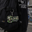 Bathing Ape Camo Japan Rubber Keychain featuring BATHING APE logo and colorful camouflage design.