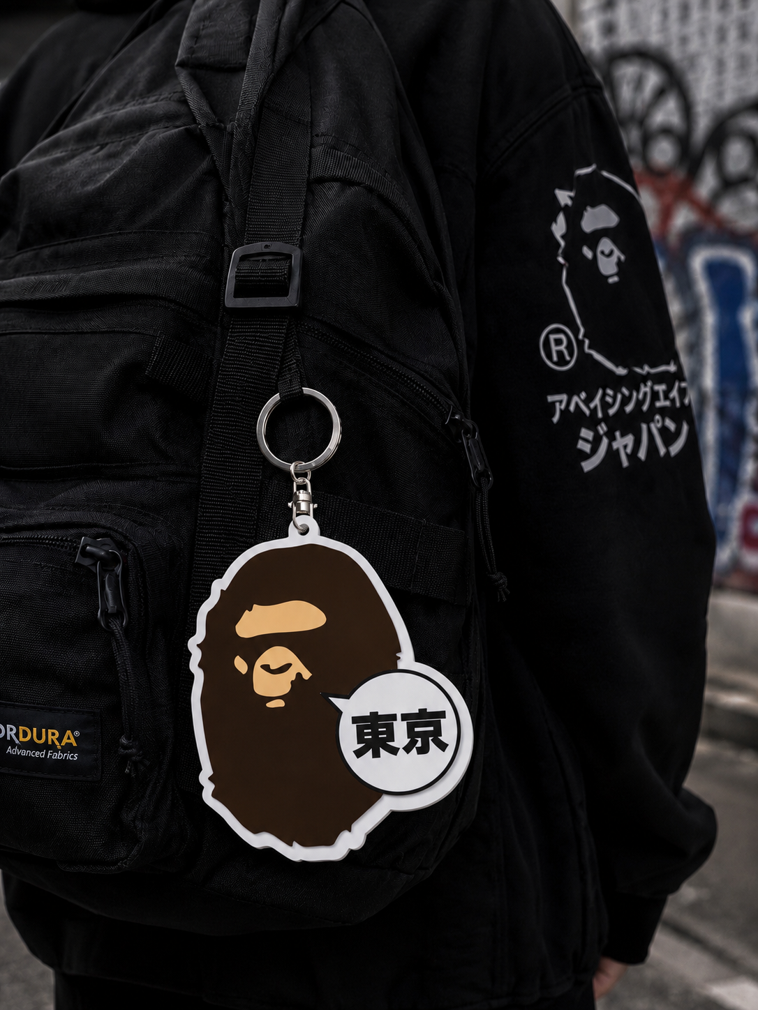 Large BATHING APE Tokyo Ape keychain featuring iconic ape face design, perfect for accessorizing bags or keys.