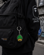 Human Made duck head keychain attached to a bag, featuring a detailed human-made duck head design in vibrant colors.