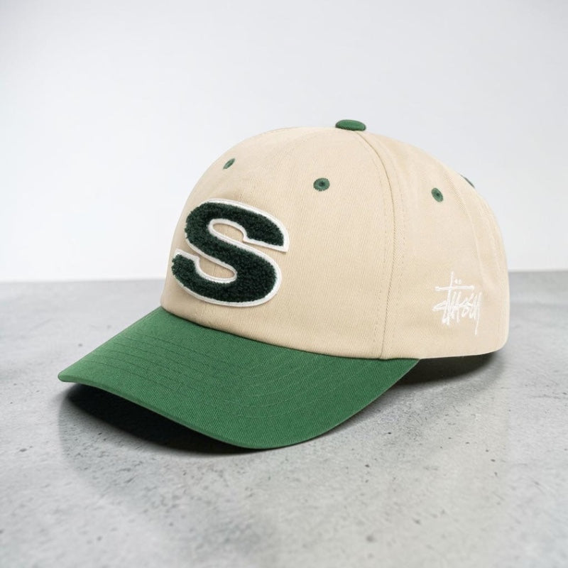 Stussy Chenille S Cap Sand, a stylish beige headwear hat featuring the Stussy logo, made of soft chenille material.