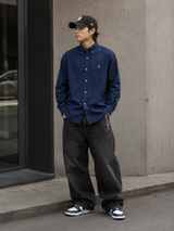 Navy Polo Ralph Lauren classic fit long sleeve shirt laid flat, showing collar, buttons, and chest pocket details.