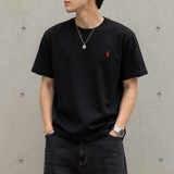 Black Polo Ralph Lauren Classic Fit heavyweight short sleeve tee displayed on a hanger, showcasing its simple crew neck and cotton fabric.