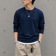 Navy Polo Ralph Lauren classic fit heavyweight long sleeve tee, casual apparel with a crew neck and long sleeves laid flat.