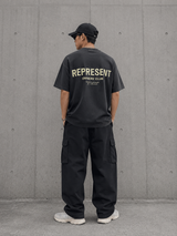 Represent Owners Club Logo Tee in aged black, featuring the brand's distinctive logo on the front, casual fit, and soft fabric.