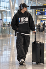 Black Fear of God Essentials NBA hoodie, comfortable apparel with NBA logo, featuring a soft fabric and stylish design.