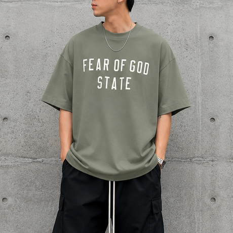Fear of God Essentials 90's Tee Moss, casual men's t-shirt with retro style, soft fabric, and classic fit.