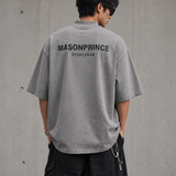 Dark grey MasonPrince oversized mock neck tee with reflective accents, casual fit, and long sleeves.
