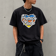 Black Human Made Tri-Color Heart Logo Tee featuring a colorful heart design on the front, casual apparel for streetwear style.