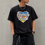 Black Human Made Tri-Color Heart Logo Tee featuring a colorful heart design on the front, casual apparel for streetwear style.