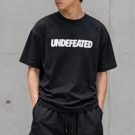 Black Undefeated Signature Logo Tee shirt featuring the brand's logo on the front, casual apparel for everyday wear.
