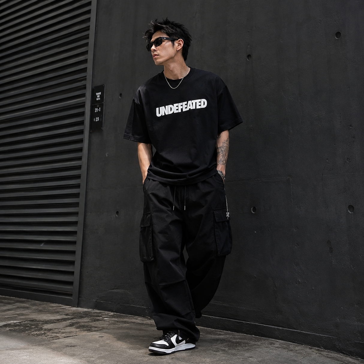 Black Undefeated Signature Logo Tee shirt from UNDEFEATED with the brand's logo on the front, made of soft cotton fabric.