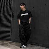 Black Undefeated Signature Logo Tee shirt from UNDEFEATED with the brand's logo on the front, made of soft cotton fabric.