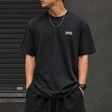 Supreme Warm Up Logo Tee in washed black, casual apparel with Supreme branding and a classic crew neck design.