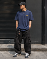 Supreme Warm Up Logo Tee in navy, casual t-shirt with Supreme branding, displayed flat on a white background.