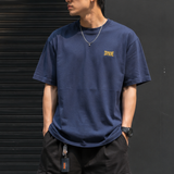 Supreme navy warm-up logo T-shirt, casual apparel with brand logo, displayed flat on a white background.