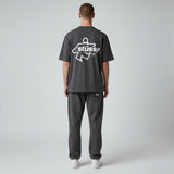 Black Stussy Surf Logo T-shirt featuring a prominent surf logo design on the front, casual apparel for streetwear and surf style.
