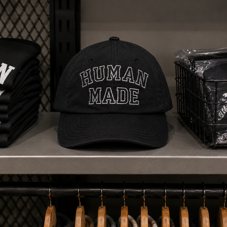 Black Human Made embroidered logo 6-panel cap, stylish headwear with detailed stitching and adjustable fit.