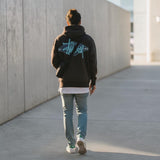 Black Stussy Diamond Logo Zip Hoodie with front zipper, hood, and logo design, made of comfortable sweatshirt material.