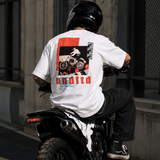White Undefeated Moto Tee shirt with graphic design, casual fit, and short sleeves.