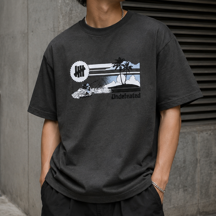 Grey Undefeated Jet Ski Tee shirt with graphic print, casual streetwear top, shown on a plain background.