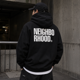 Black Neighborhood Classic Zip Hoodie displayed on a hanger, featuring the brand's logo on the chest and a front zipper.
