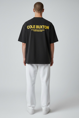 Cole Buxton Signature Tee in vintage black with yellow accents, casual apparel featuring a classic fit and bold color contrast.