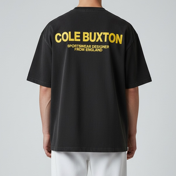 Cole Buxton Signature Tee in vintage black with yellow branding, featuring a classic fit and soft cotton fabric.
