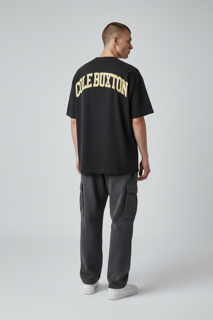 Yellow Arc Tee by Cole Buxton with vintage black fabric, casual apparel featuring a graphic arc design on the front.