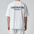 White Cole Buxton Signature Tee displayed on a hanger, showcasing a classic crew neck and minimalist design.
