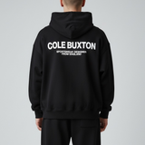Black Cole Buxton Signature Hoodie, casual apparel with a relaxed fit, featuring the brand's logo and soft fabric texture.