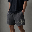 Represent Script Mesh Shorts Vintage Black featuring black mesh fabric and embroidered script logo for a stylish athletic look.