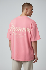 Pink Represent Owners Club Script T-shirt featuring the brand's logo in bold lettering on the front.