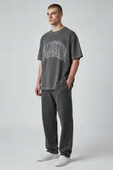 Cole Buxton Arch Logo Tee in washed black, casual men’s t-shirt with a bold logo design on the front.