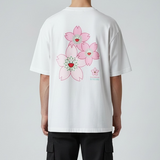 Takashi Murakami embroidered patch Sakura flower on a white tee, casual apparel featuring colorful floral artwork.