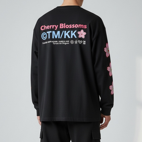 Black Takashi Murakami long sleeve tee featuring embroidered Sakura flower patch, showcasing artistic Japanese-inspired design.
