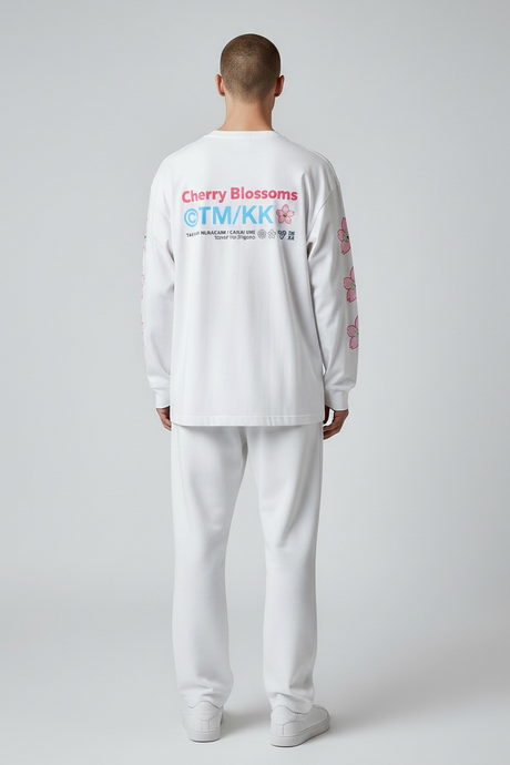 Takashi Murakami white long sleeve tee with embroidered Sakura patch, showcasing vibrant floral artwork on the front.