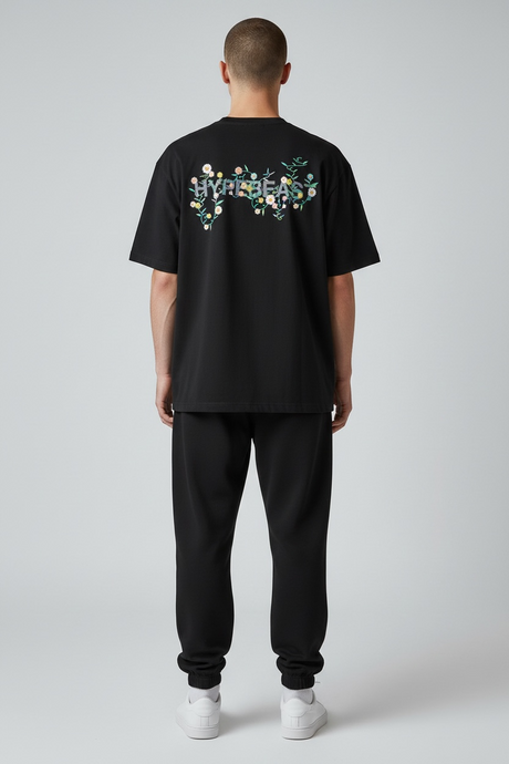 Takashi Murakami X HB 20th Anniversary black limited edition T-shirt showcasing vibrant graphic artwork and branding.