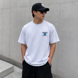 Heather gray Undefeated Trademark Tee featuring the brand's logo printed on the front, casual crewneck t-shirt.